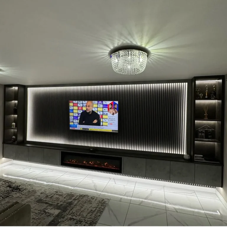 Floating media wall with LED lighting and recessed TV