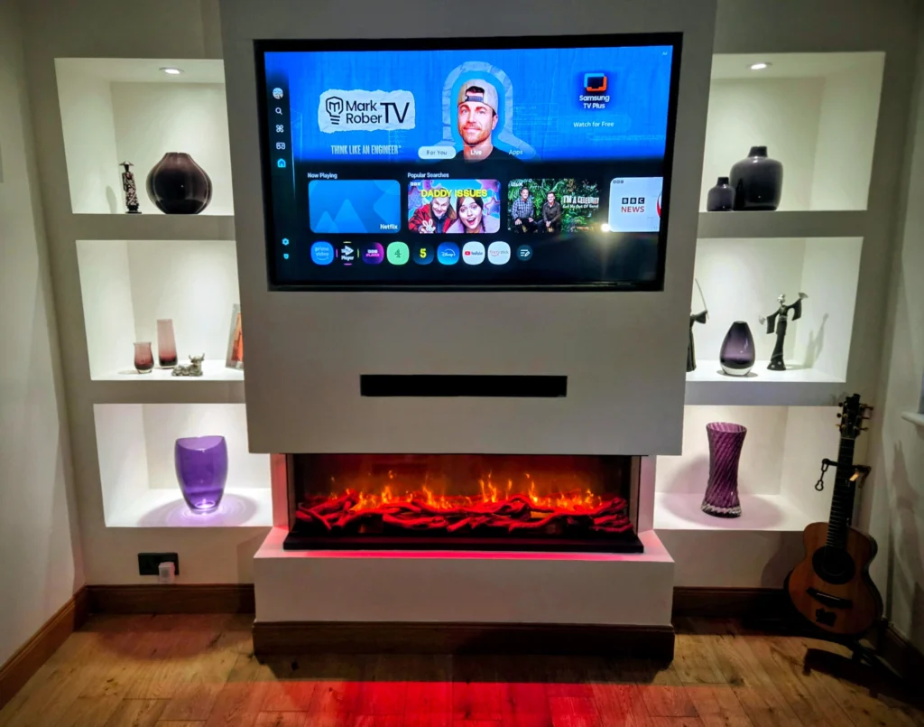 Media wall with open display shelves, wall-mounted TV and electric fire
